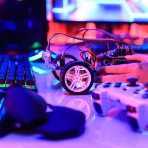 teenager-plugging-energy-and-signal-cable-to-sensor-chip-of-toy-car-workshop teenager-plugging-energy-and-signal-cable-to-sensor-chip-of-toy-car-workshop